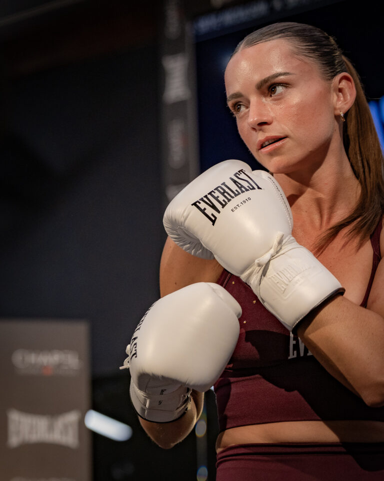 Australian boxer Skye Nicolson poses with white Everlast gloves during a boxing and fitness event.